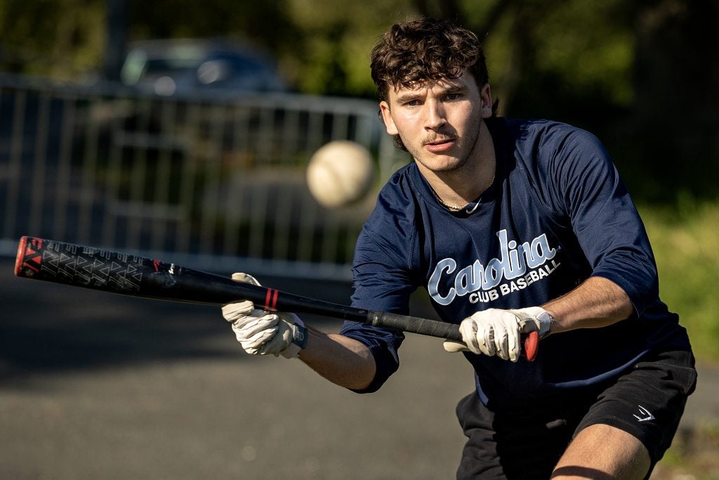 Senior Brantlee Bryant bunts during batting practice.