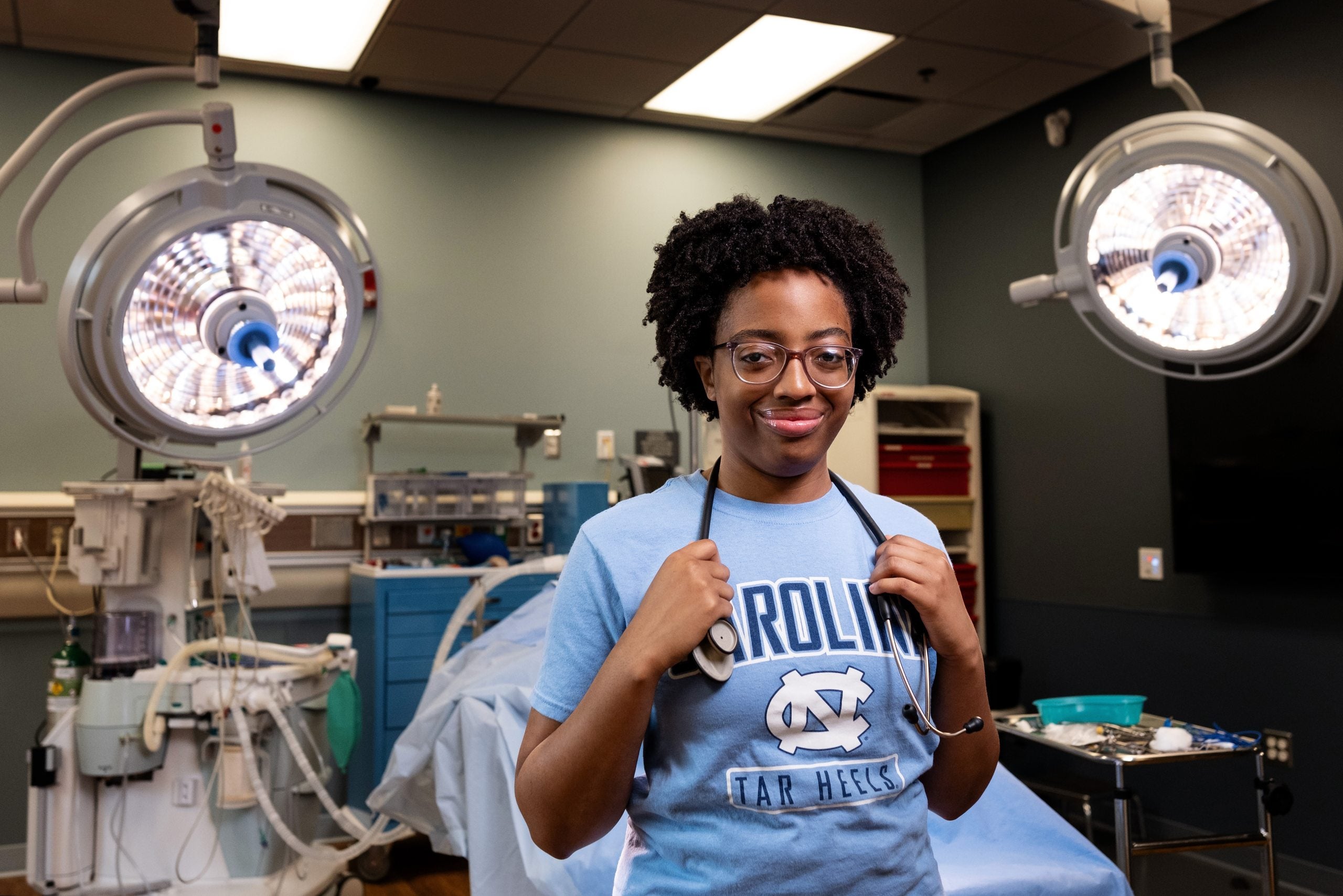 Naomi King posing for portrait in hospital training room on the campus of UNC-Chapel Hill.