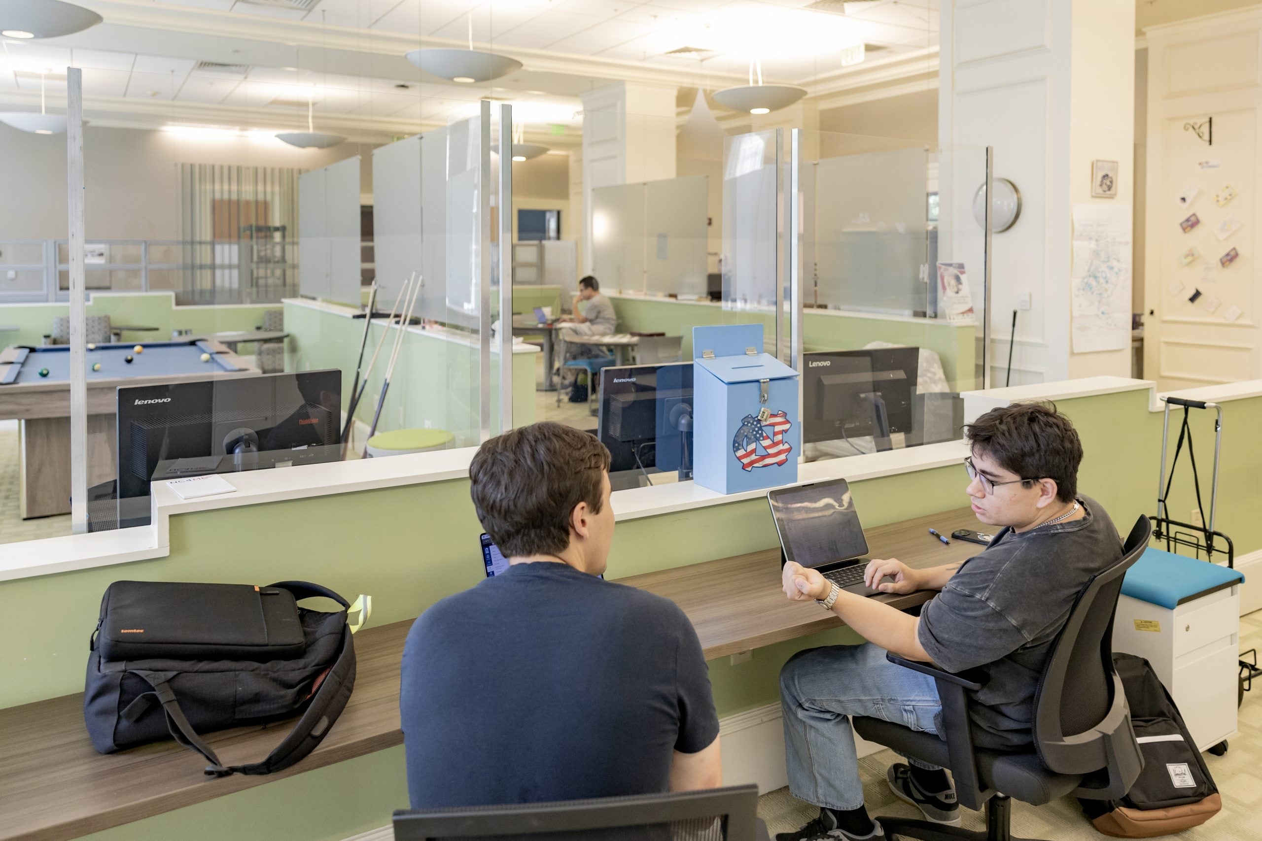 Two students talking to each other at UNC-Chapel Hill's Military and Veteran Student Success Center.