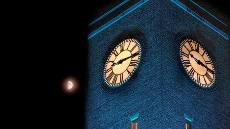 The Bell Tower lit up with blue lights.
