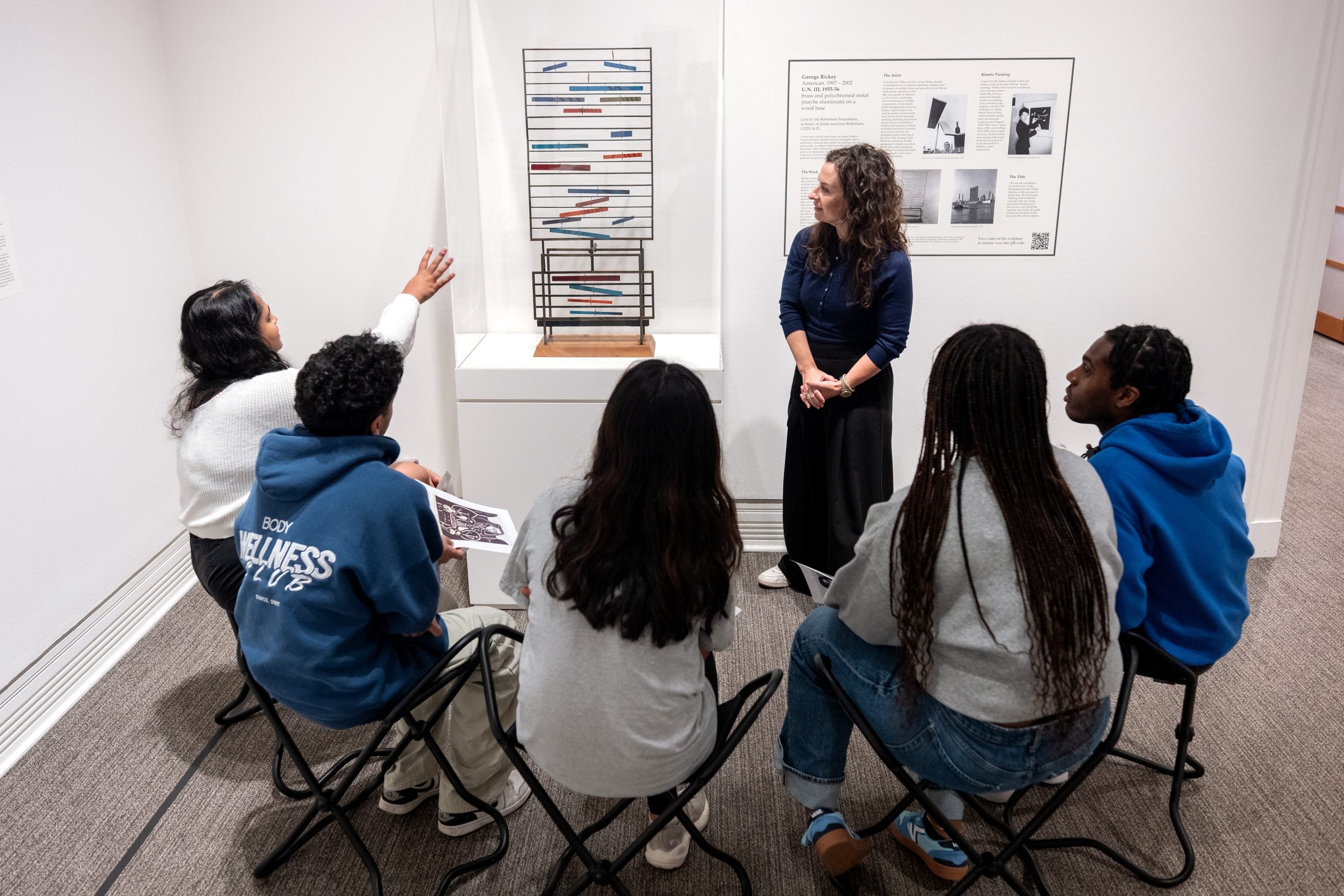 Manekin next to U.N. III piece with Robertson scholars.