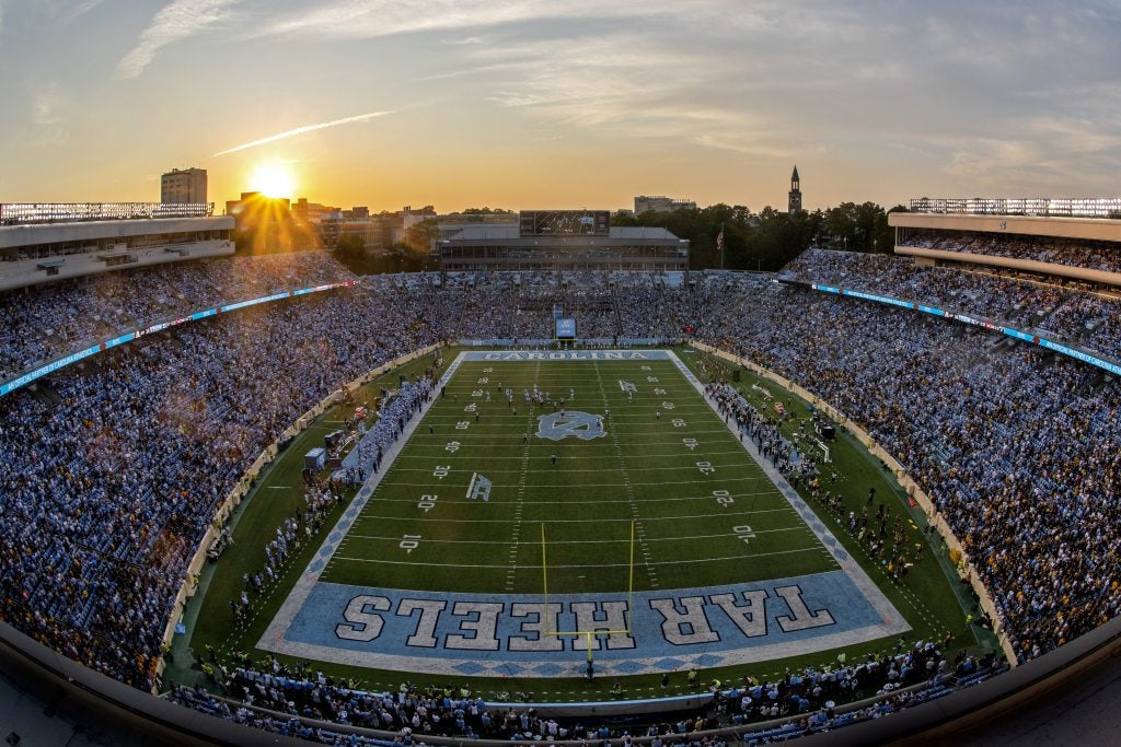 Kenan Stadium at sunset during a football game on the campus of U.N.C Chapel Hill.