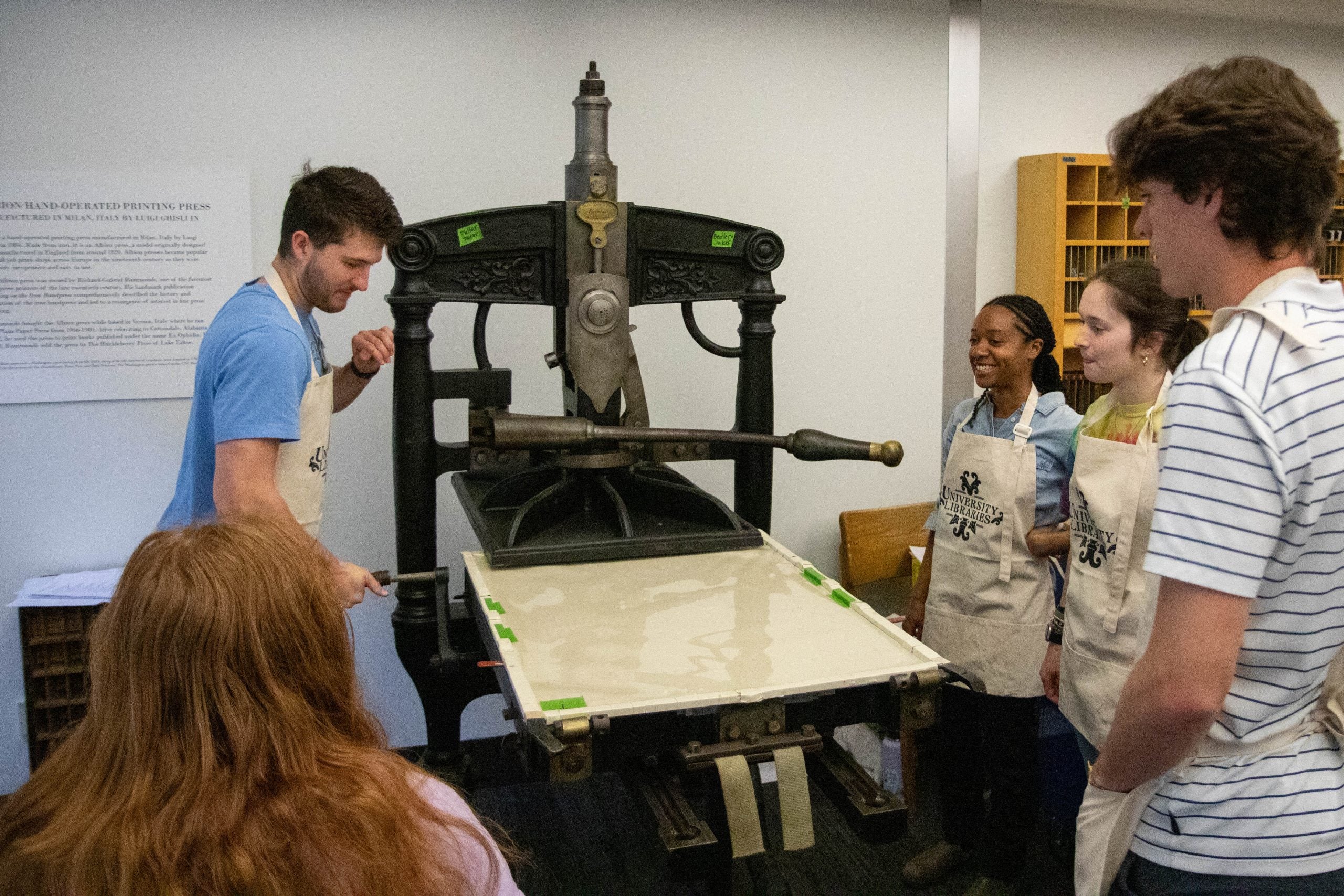 Students use the 1884 press during a class.