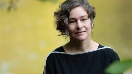 Miriam in front of a body of water