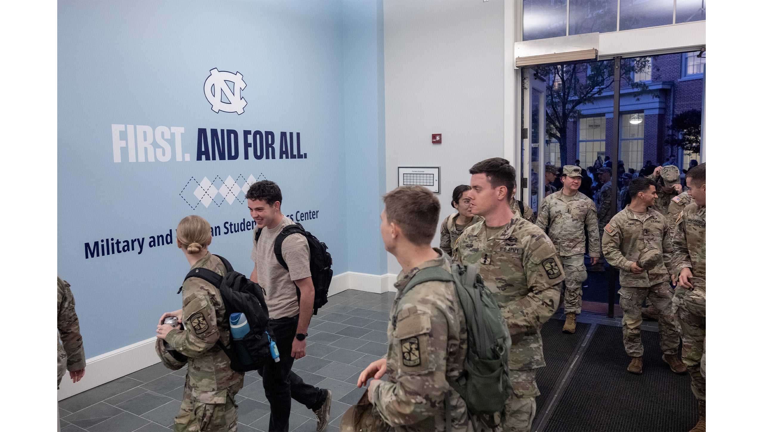 UNC-Chapel Hill ROTC members walking into the Military and Veteran Student Success Center.