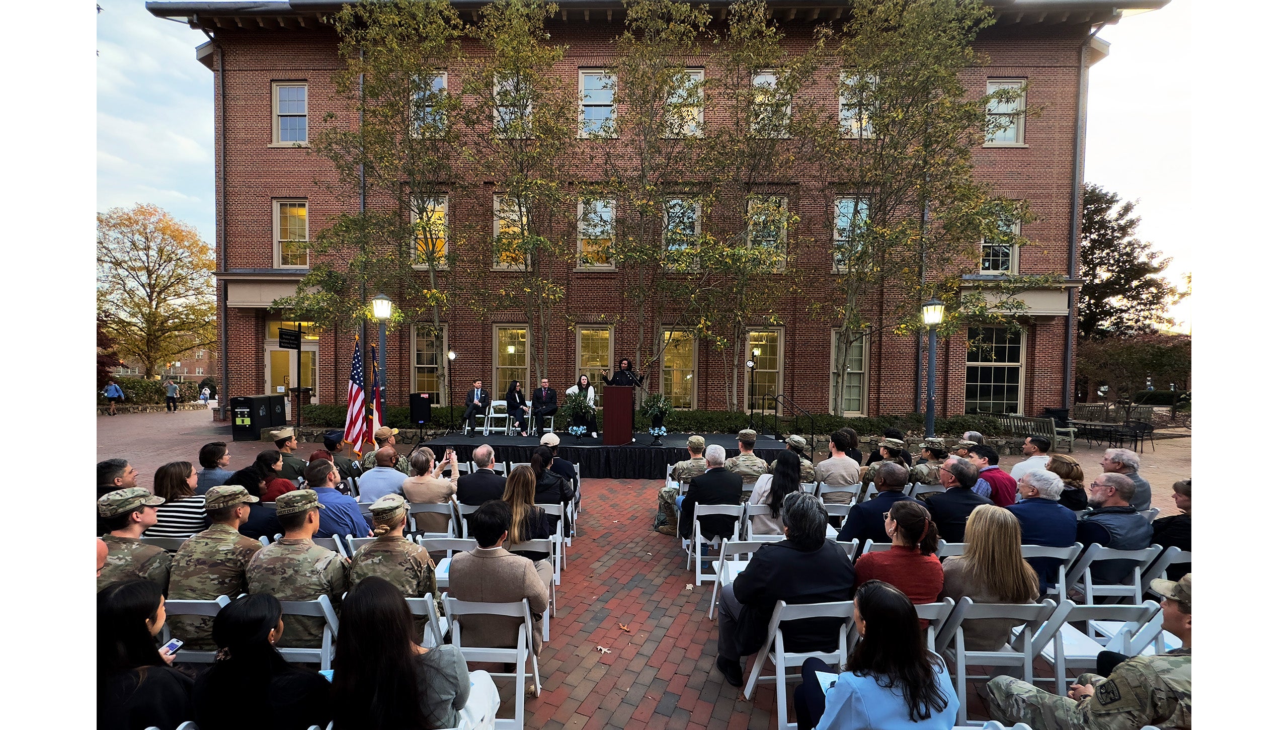 Wide-angle shot featuring rows of attendees at the grand opening of the UNC-Chapel Hill Military and Veteran Student Success Center.