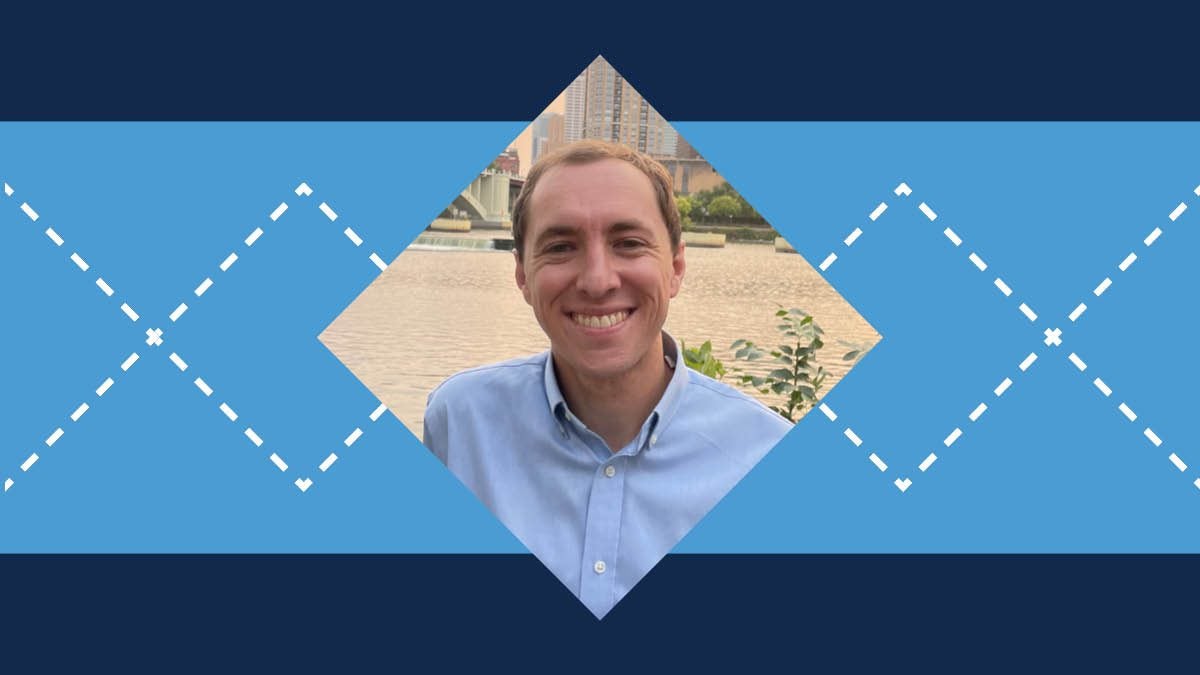 Argyle patterned graphic with Carolina Blue and Navy blue colors with a picture of Andy Boyle in the middle.