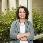 Aimee Wall standing by a window.