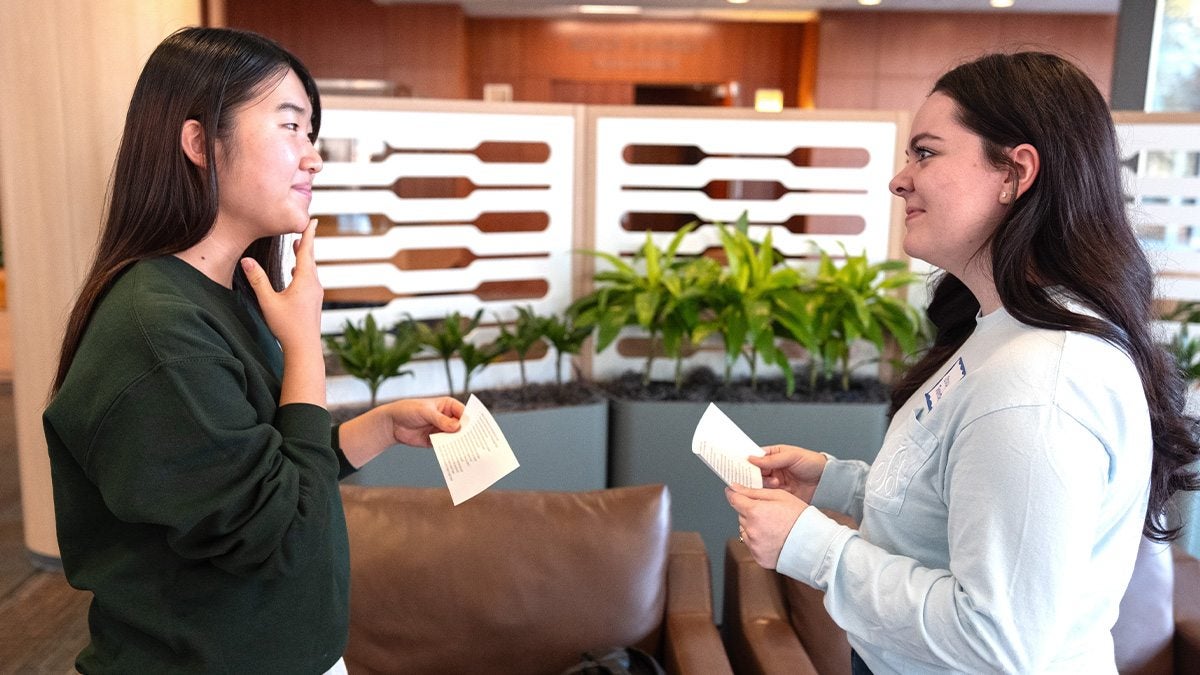 Two UNC-Chapel Hill students, Kokoro Waka and Stacy Thornton, talking to each other at a Speaking Group meetup.