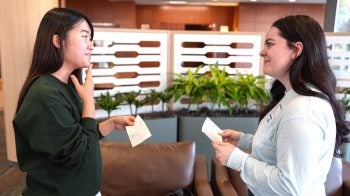 Two UNC-Chapel Hill students, Kokoro Waka and Stacy Thornton, talking to each other at a Speaking Group meetup.