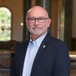 Stan Ahalt posing for portrait in Wilson Library