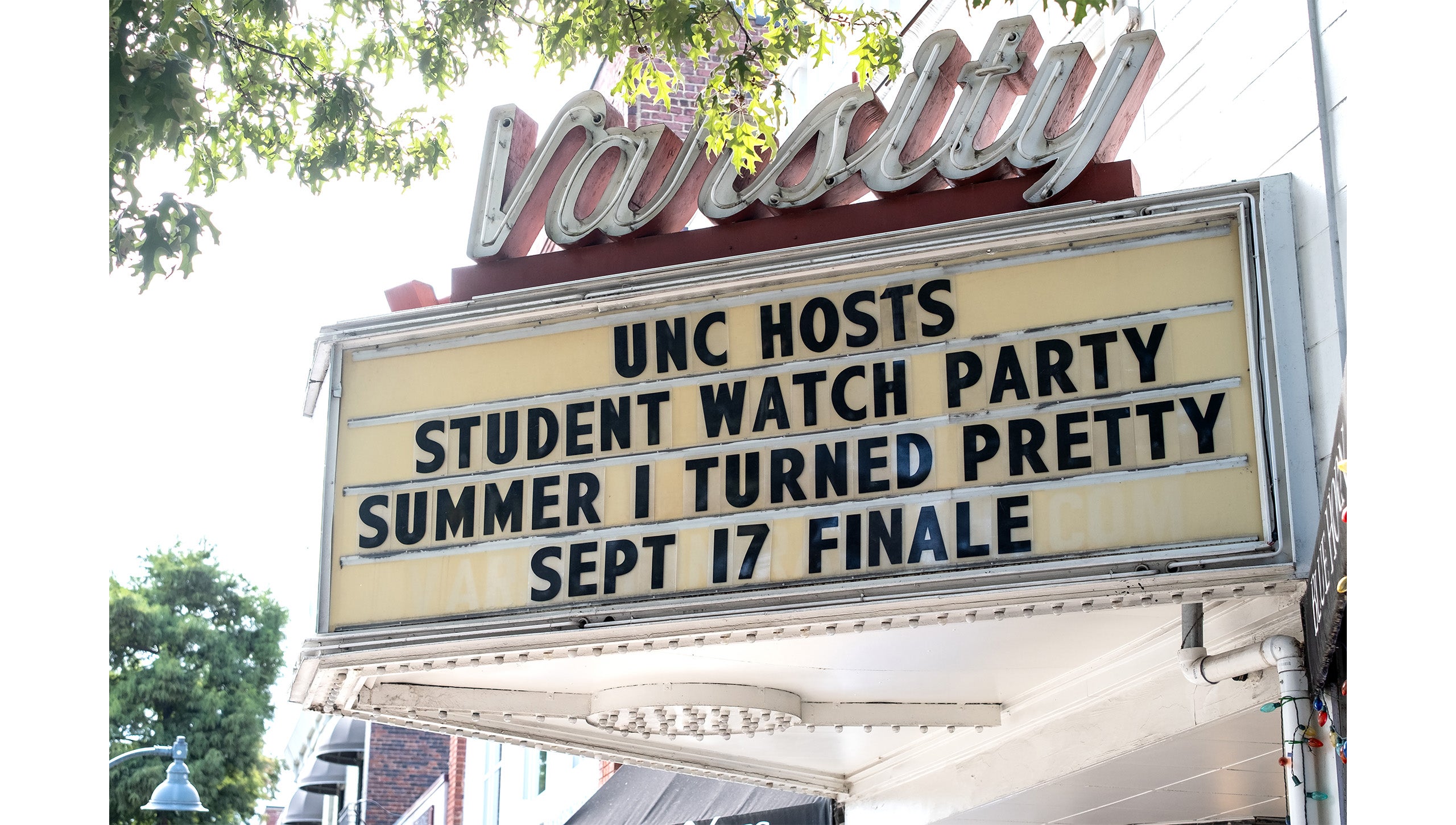 Varsity Theatre sign on Franklin Street with text reading: “UNC hosts student watch party: Summer I Turned Pretty; Sept 17 Finale