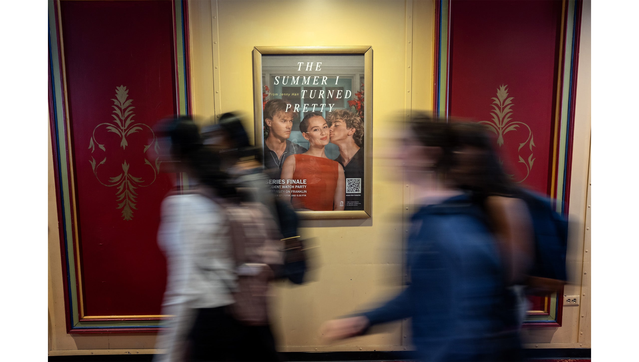 Poster board for “The Summer I Turned Pretty” watch party in the lobby of the Varsity Theatre in downtown Chapel Hill.