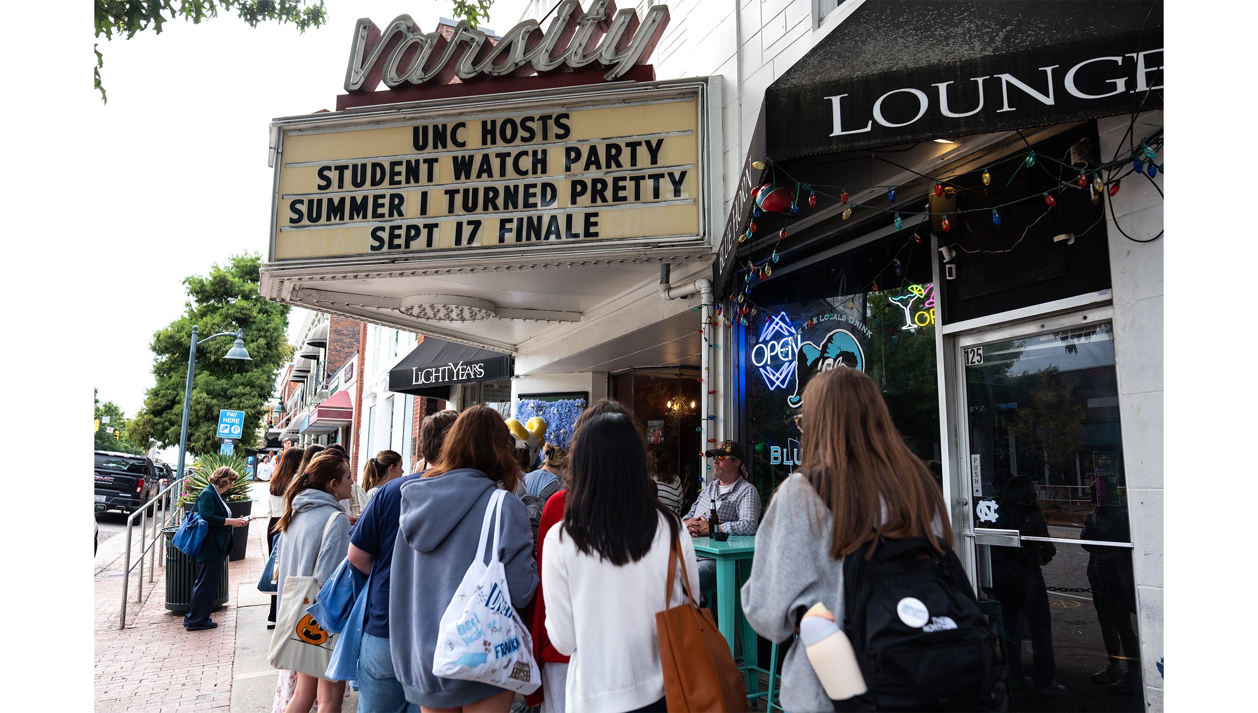 Lines of students waiting to enter the Varsity Theatre for UNC-Chapel Hill’ “The Summer I Turned Pretty” watch party.