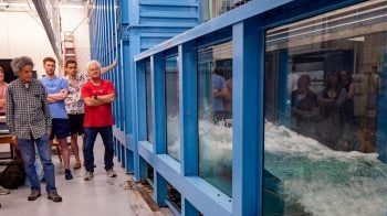 Roberto Camassa (left) and Rich McLaughlin (right) give a tour of the UNC Fluids Lab.