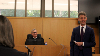 A person representing a teen in a mock trial.