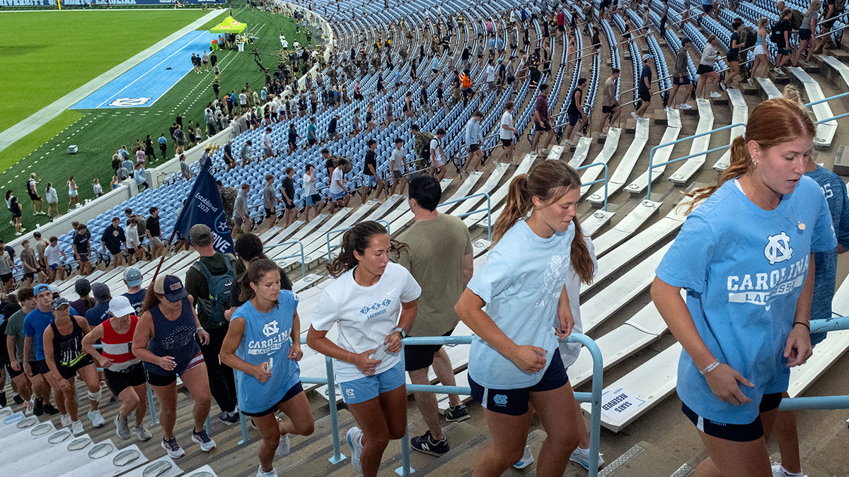 Carolina athletes climbing up the stairs of Kenan stadium.