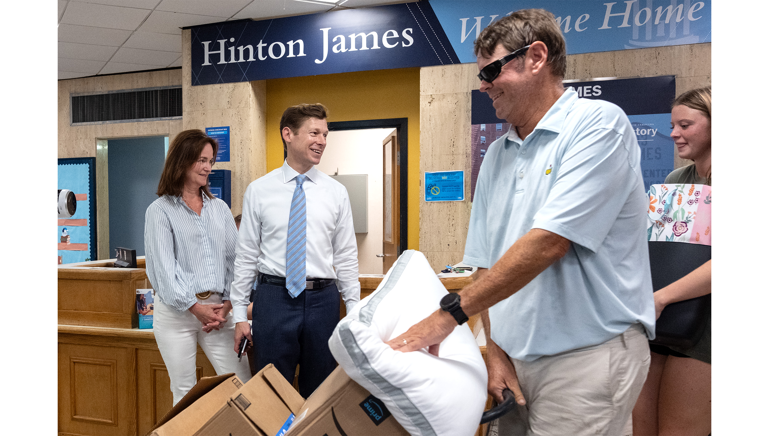 Chancellor Lee Roberts and Liz Roberts greeting incoming freshman at Hinton James.