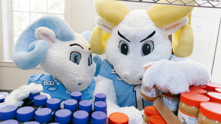 Rameses and RJ looking at peanut butter jars.