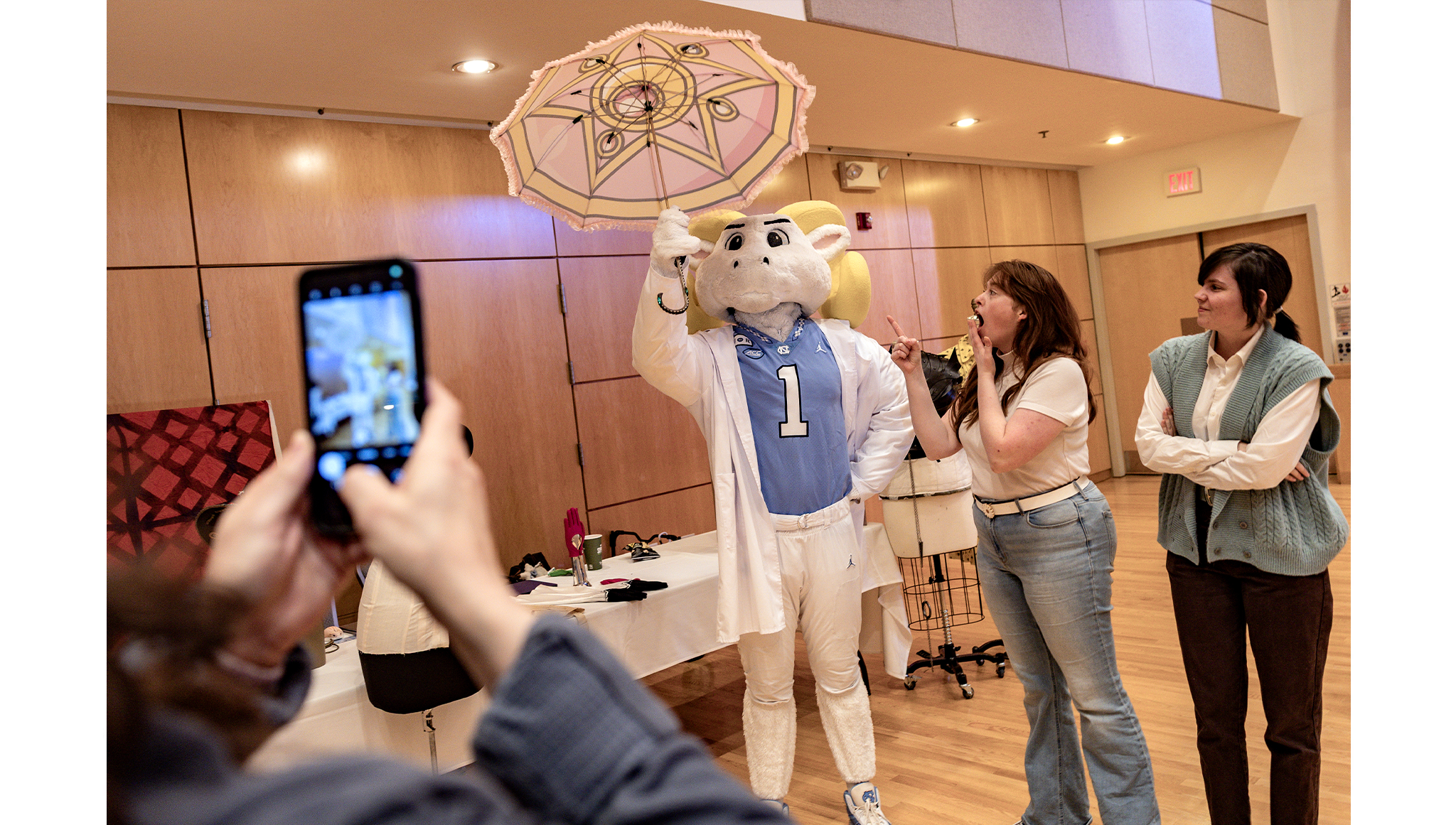 U.N.C. mascot Rameses visits the Graduate Costume Production Program table.