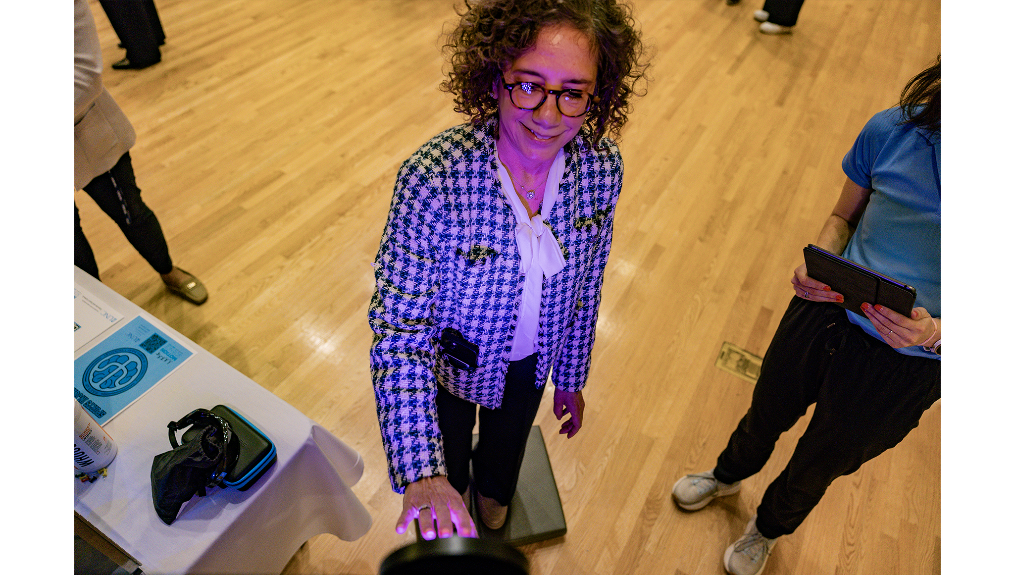 Penny Gordon-Larsen, Vice Chancellor for Research, participates in an experiment that tests upper extremity reaction time at the Exercise and Sport Science table.