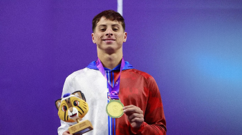 Xavier Ruiz holding medal.