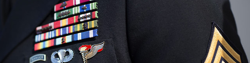 A close-up photo of a military jacket with badges.